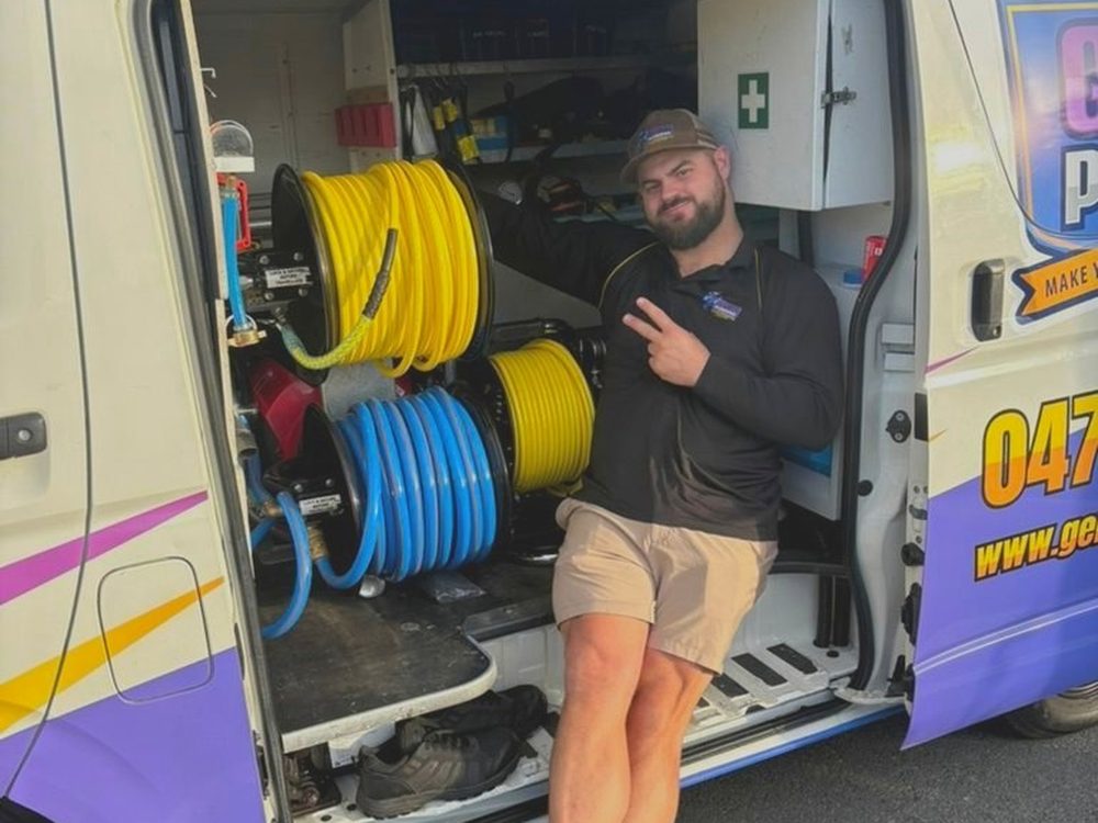 Blake, who started Genies Plumbing, at the van