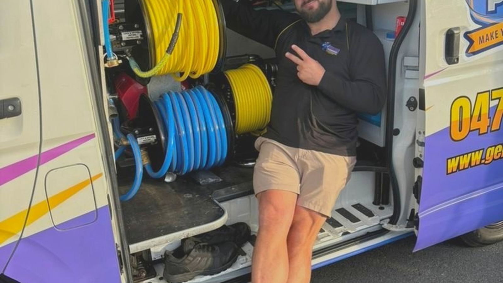 A Genies Plumbing plumber on a job